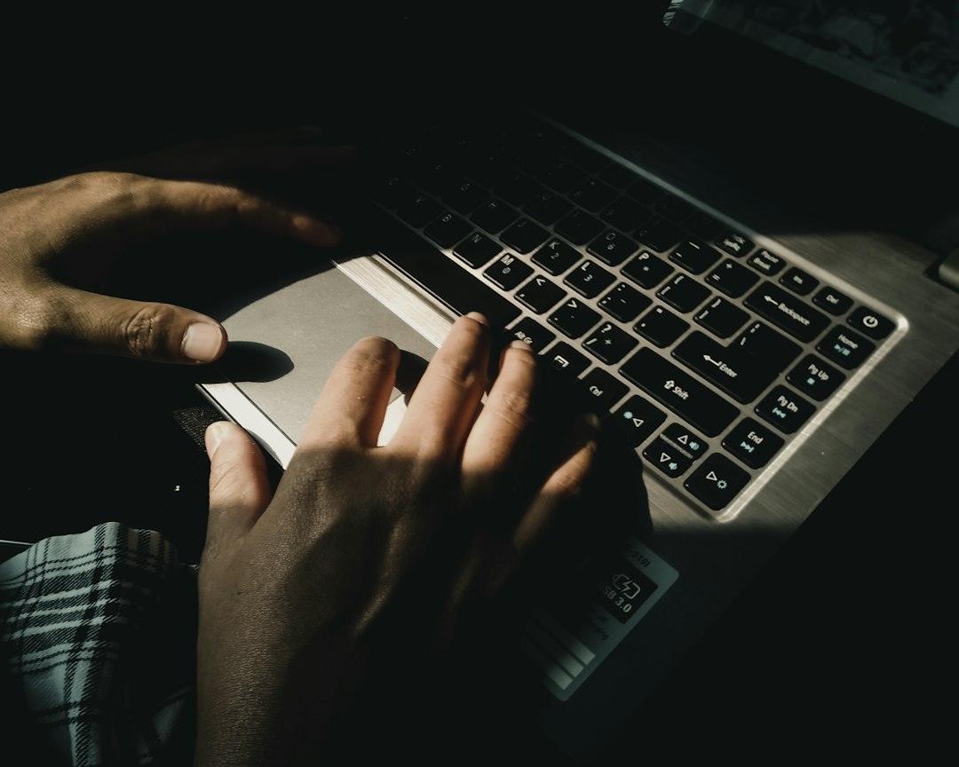 person using gray laptop computer