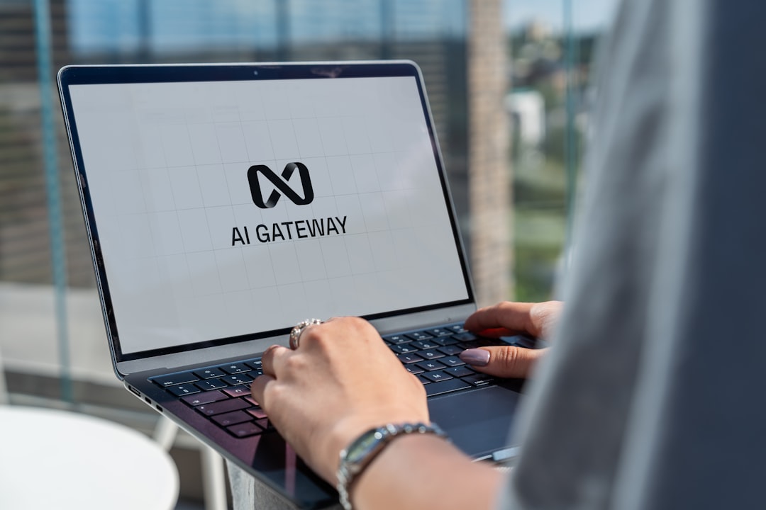 Person typing on laptop with ai gateway logo
