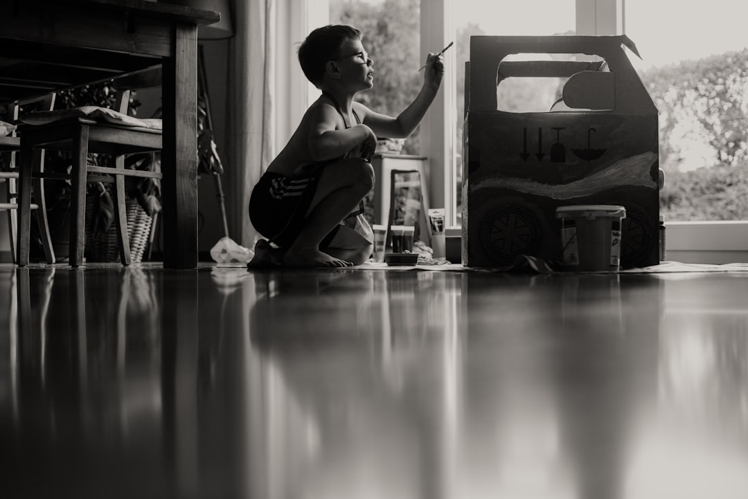 woman in black tank top sitting on floor