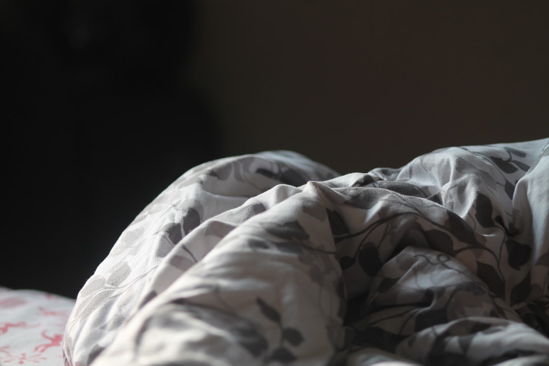 Close up of a folded blanket with a floral pattern