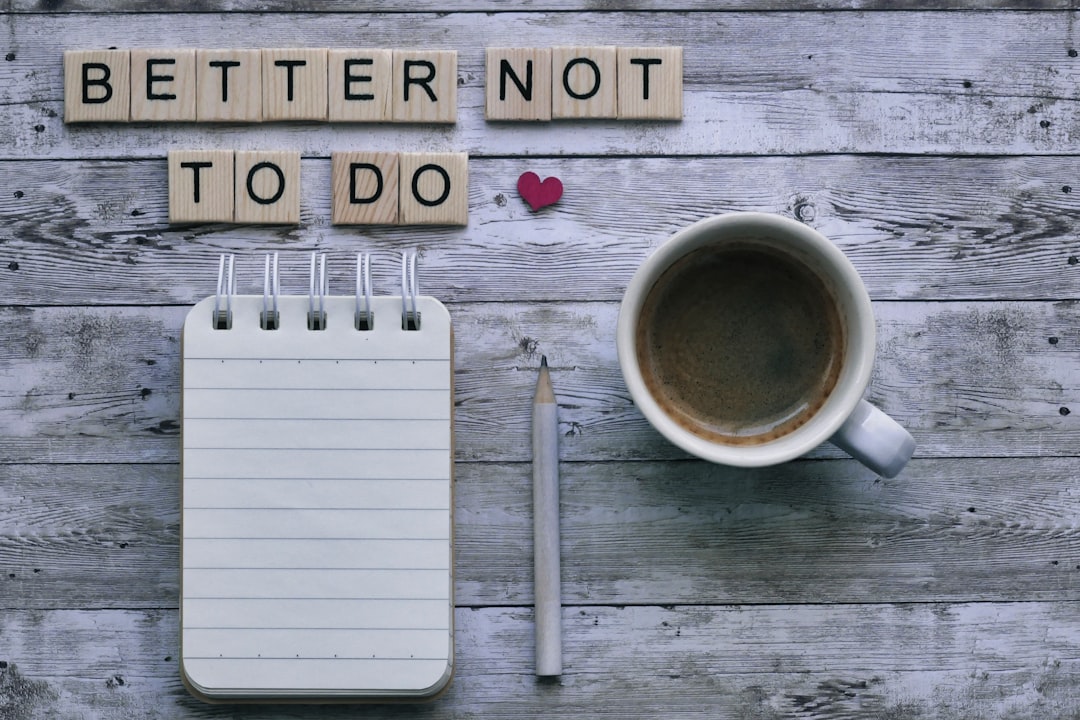 Scrabble message "better not to do" with coffee and stationery