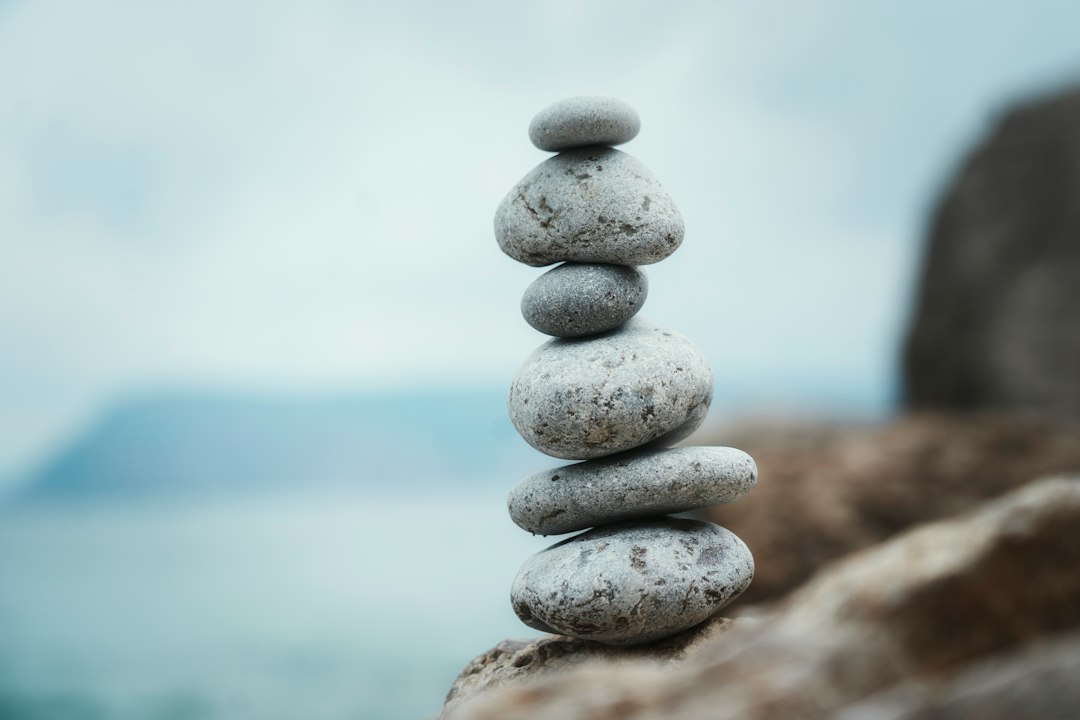 a stack of rocks sitting on top of a rocky beach