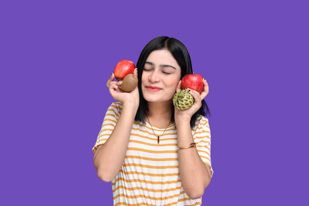 a woman holding apples