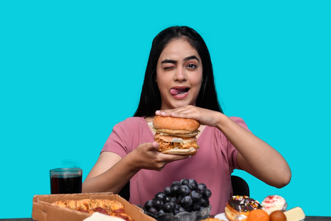 a woman holding a burger