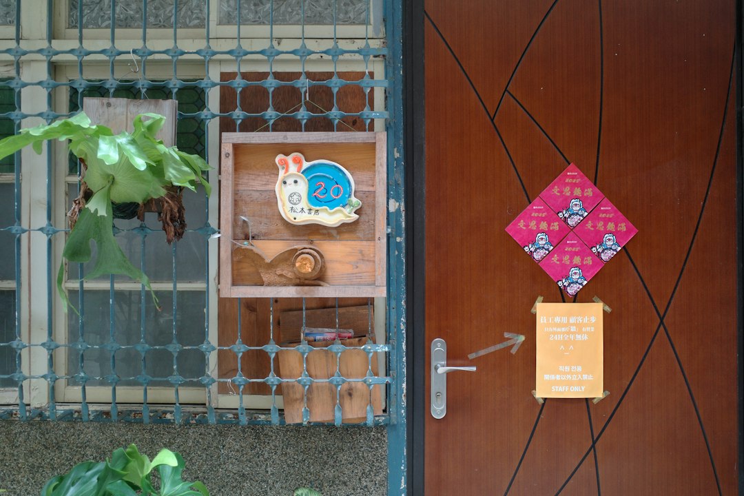 Snail decoration on a wooden shelf by the door