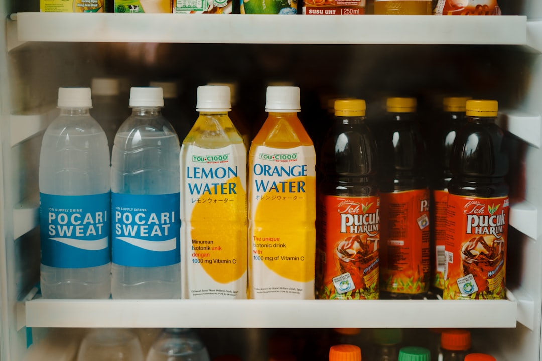 a refrigerator filled with lots of different types of drinks