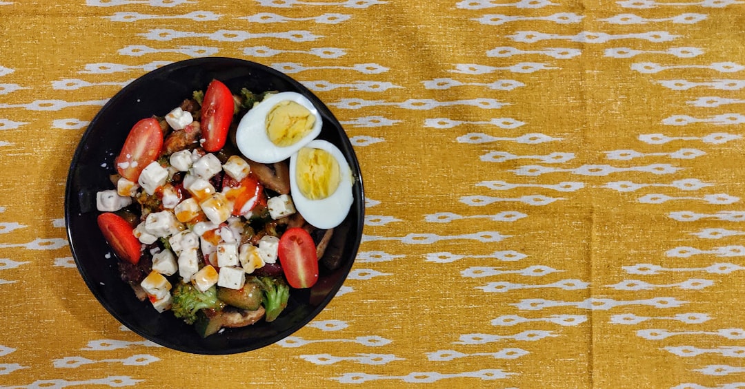vegetable salad on black ceramic bowl
