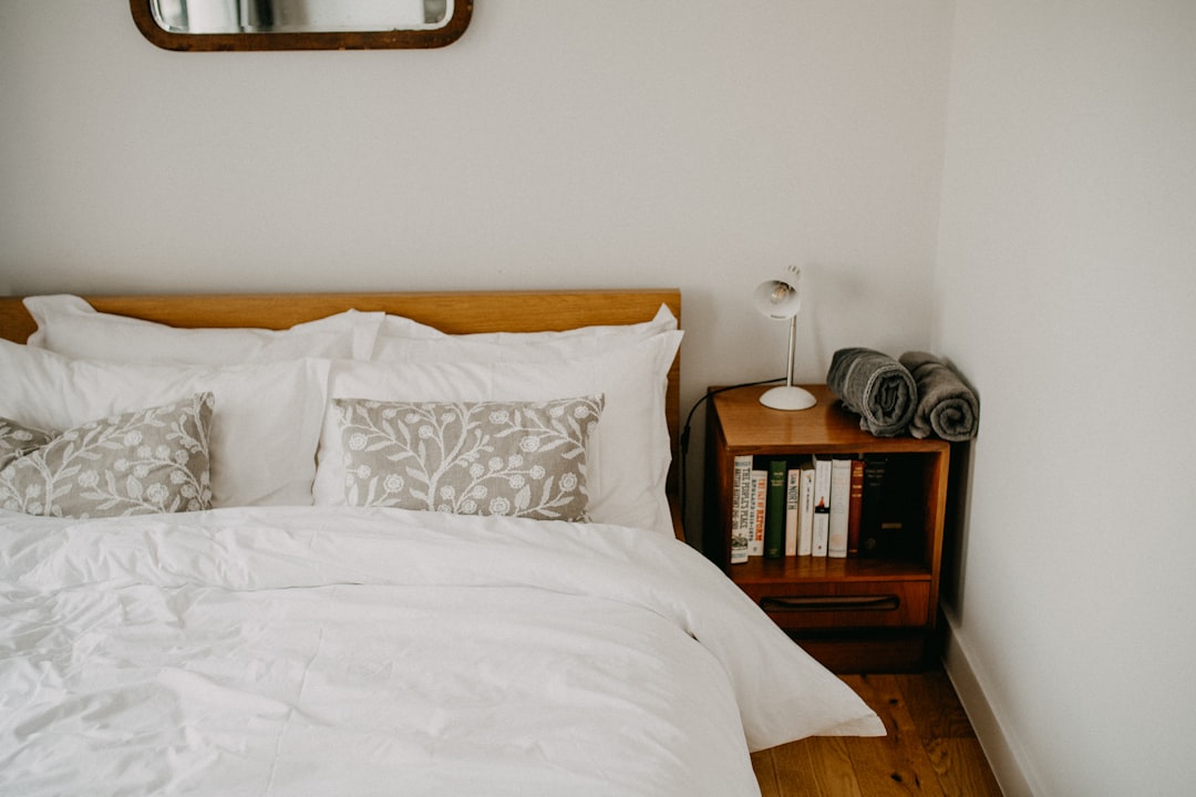 Cozy bedroom with a neatly made bed and bedside table