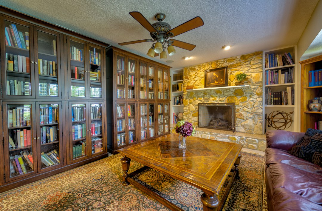 a living room with a fireplace and a table